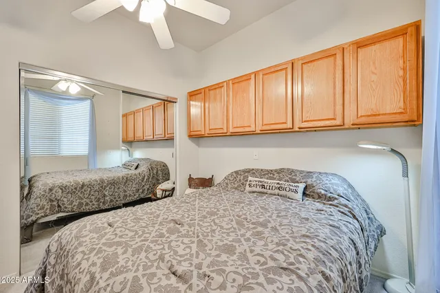 a bedroom with two beds and painted walls