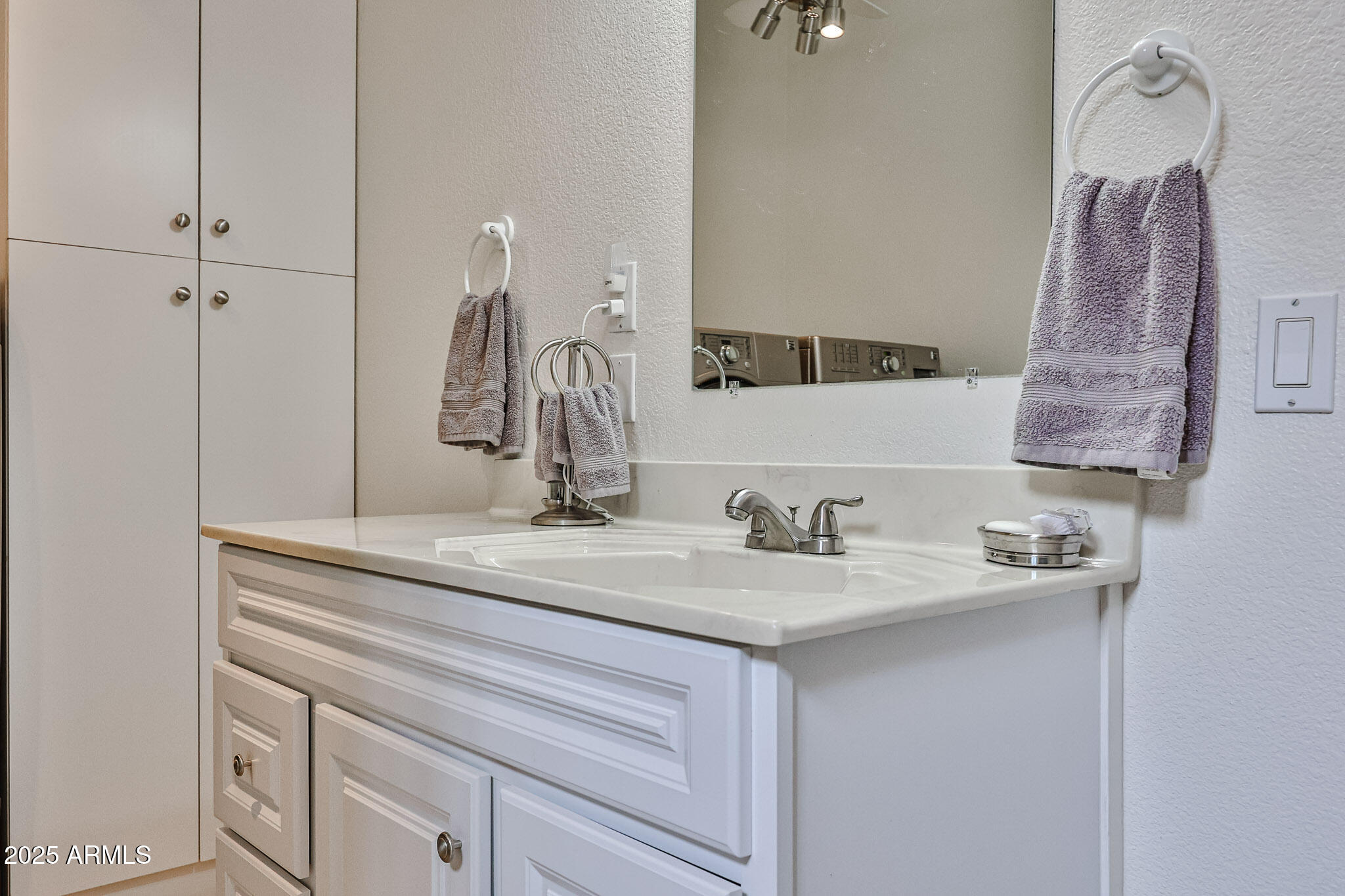 17200 West Bell Road, Unit 1185 Surprise, AZ 85374 - Photo 23 of 44 a bathroom with a sink and a mirror