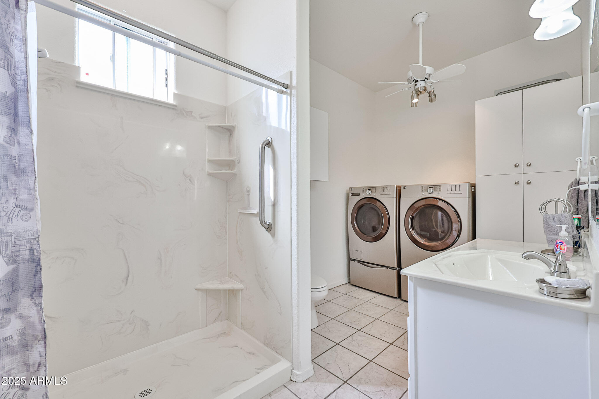 17200 West Bell Road, Unit 1185 Surprise, AZ 85374 - Photo 26 of 44 a bathroom with a sink a toilet and shower