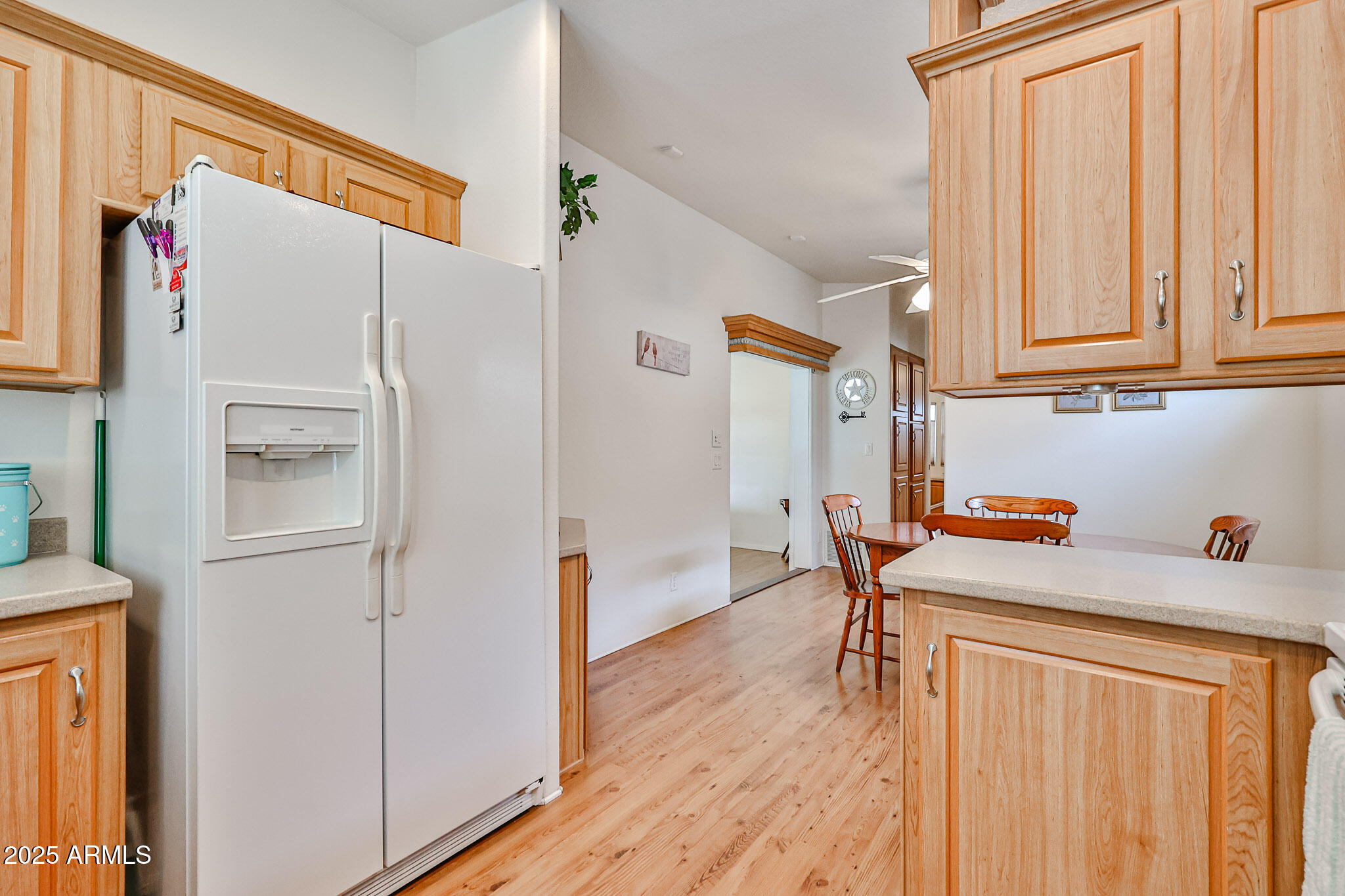 17200 West Bell Road, Unit 1185 Surprise, AZ 85374 - Photo 10 of 44 a kitchen with stainless steel appliances a refrigerator and a cabinets