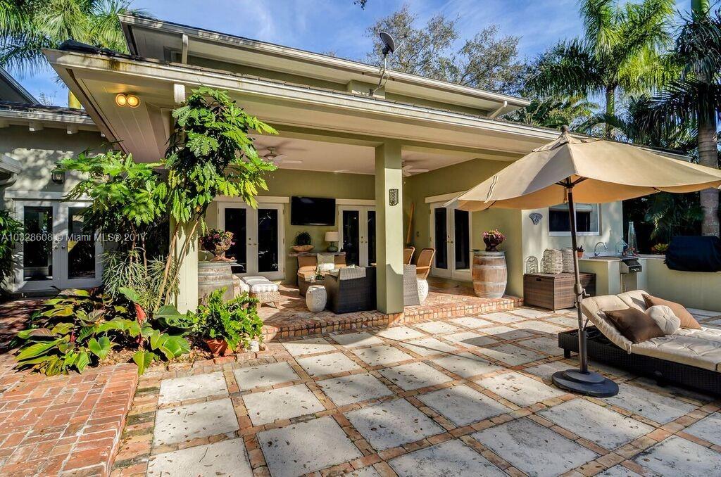 8150 Erwin Road Miami, FL 33143 - Photo 11 of 36 a view of the patio with chairs and potted plants
