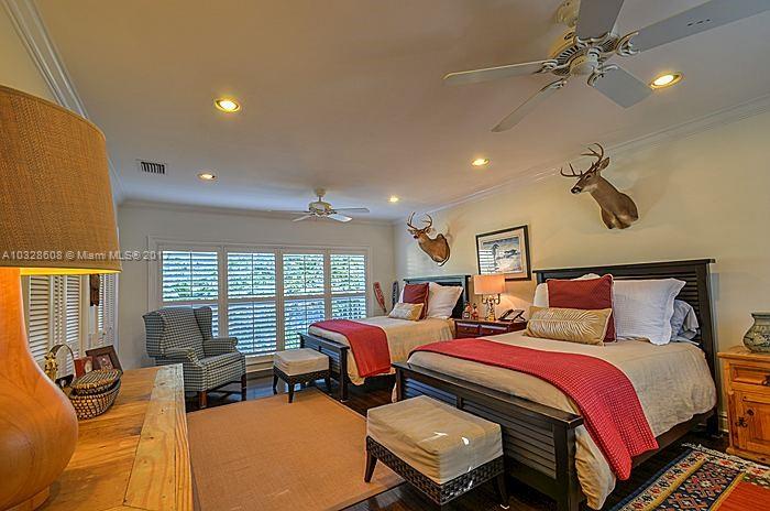 8150 Erwin Road Miami, FL 33143 - Photo 22 of 36 a bedroom with furniture and a large window