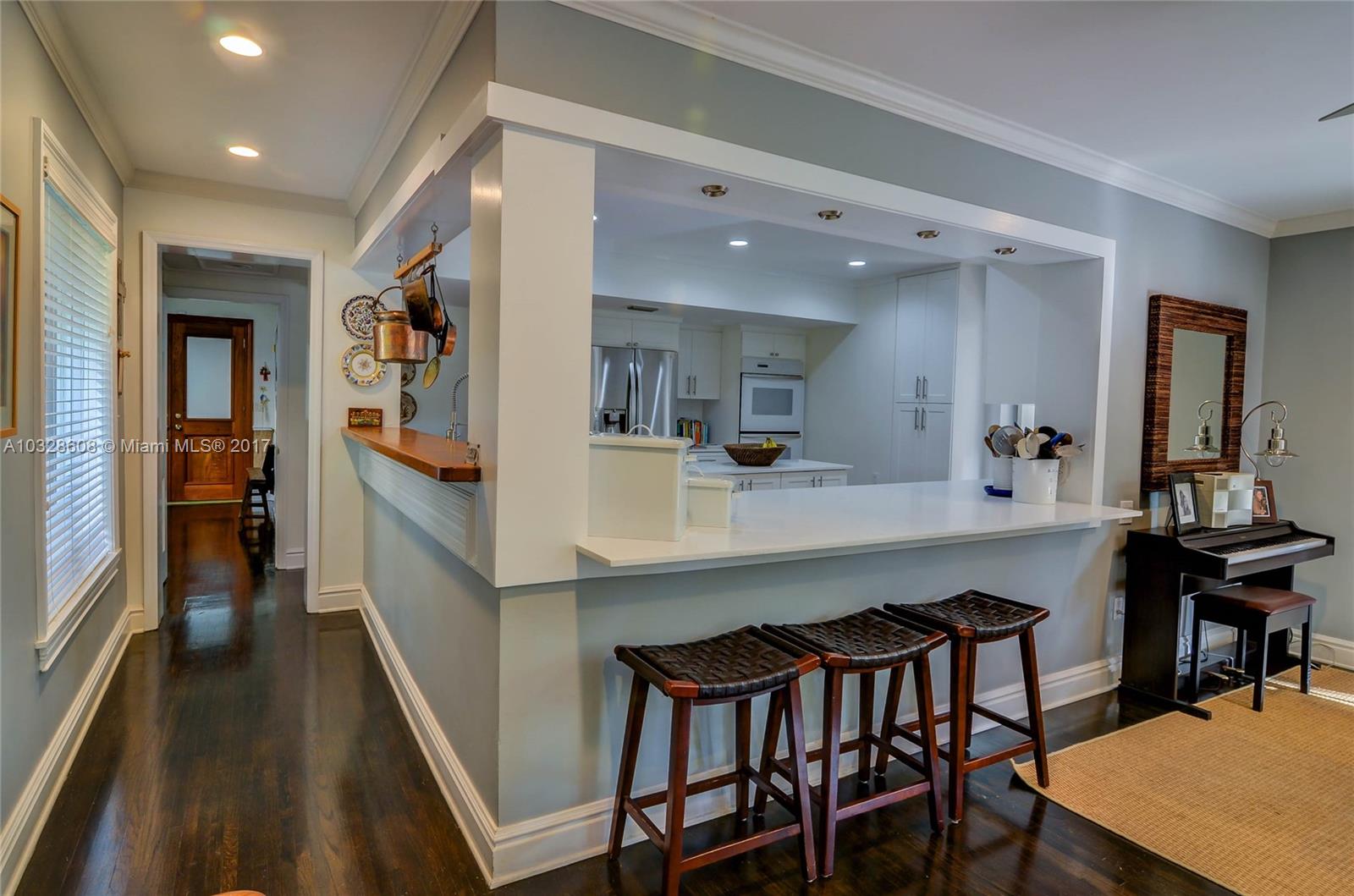 8150 Erwin Road Miami, FL 33143 - Photo 25 of 36 a dining hall with stainless steel appliances a dining table and chairs