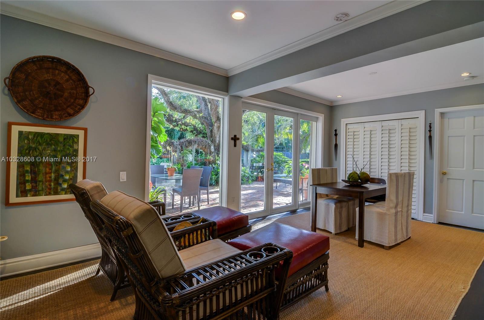 8150 Erwin Road Miami, FL 33143 - Photo 26 of 36 a living room with furniture and a floor to ceiling window