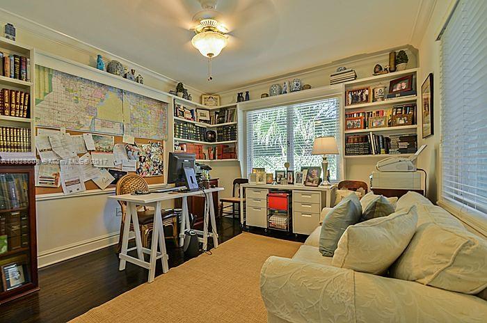 8150 Erwin Road Miami, FL 33143 - Photo 28 of 36 a living room with furniture a fireplace and a large window