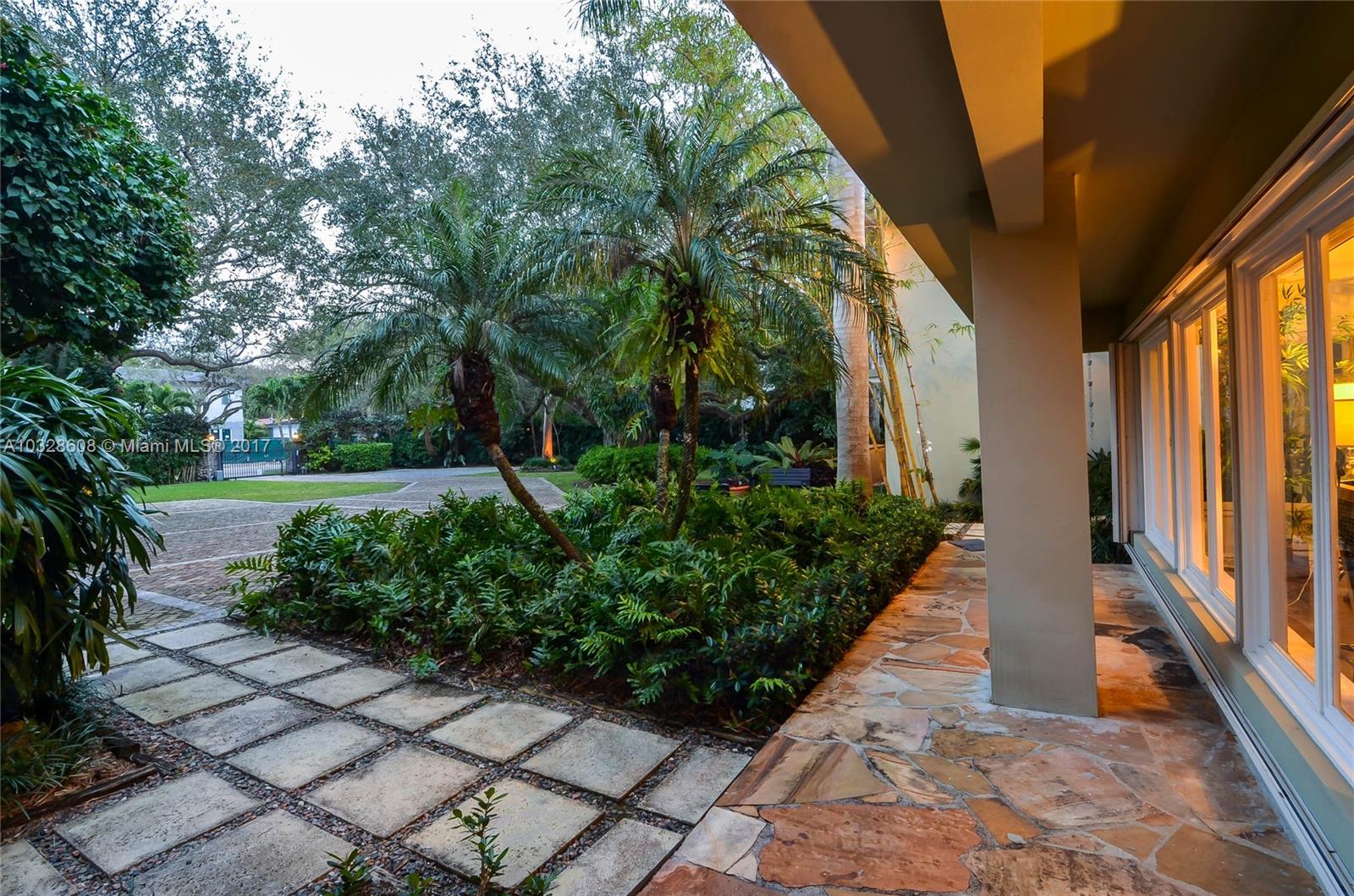 8150 Erwin Road Miami, FL 33143 - Photo 30 of 36 a view of a house with a backyard