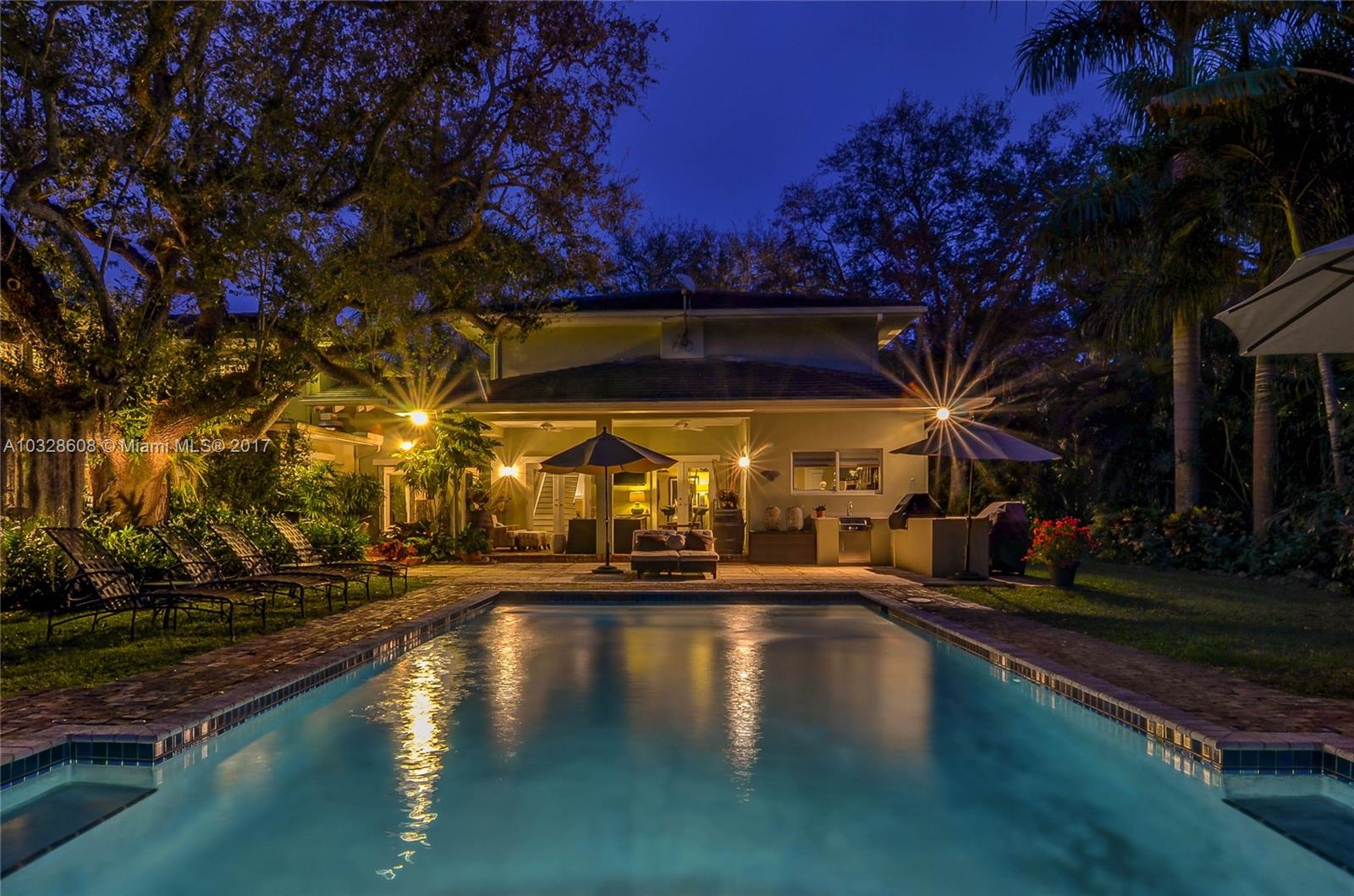 8150 Erwin Road Miami, FL 33143 - Photo 33 of 36 a view of a swimming pool with an outdoor space and seating area