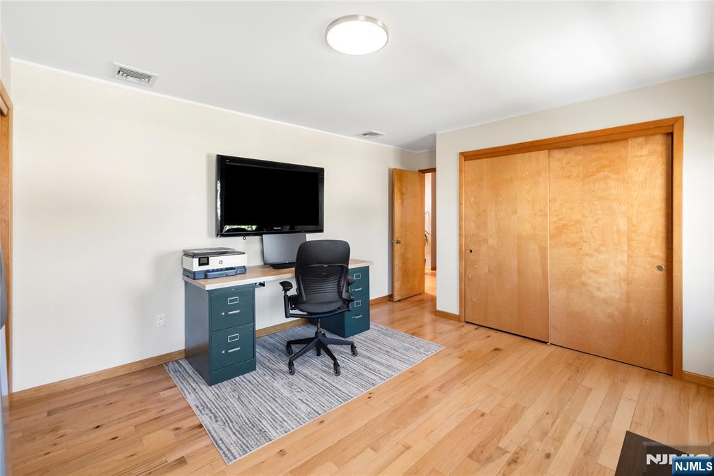 66 Roehrs Drive Wallington, NJ 07057 - Photo 24 of 37 a view of a workspace with furniture and a window