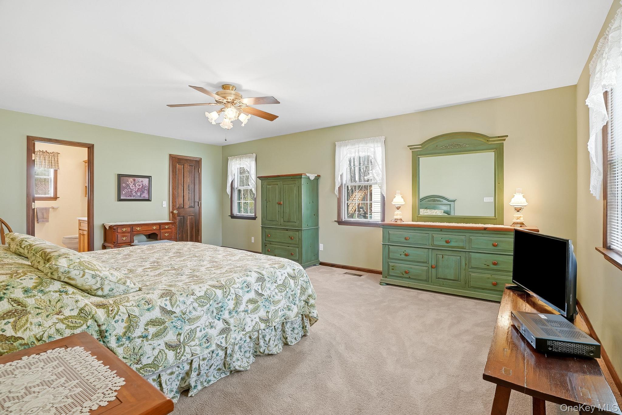 73 Sunset Road Montrose, NY 10548 - Photo 11 of 41 The main level owner's suite runs from front-to-back.