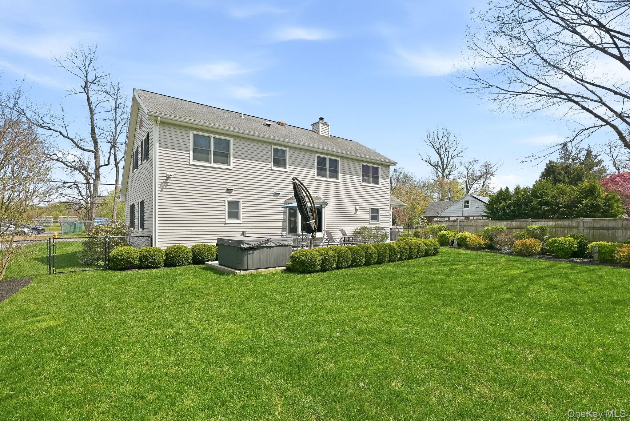73 Sunset Road Montrose, NY 10548 - Photo 33 of 41 Head out back to the manicured gardens and lush green lawn.