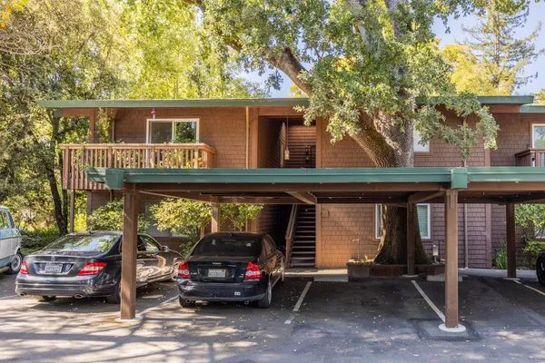 a view of a car park in front of house