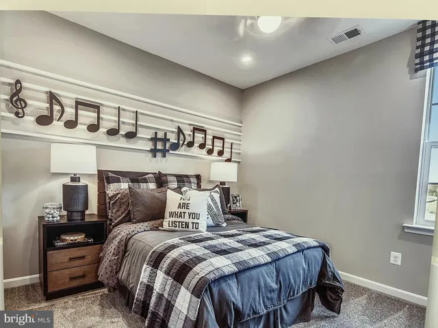 a bedroom with a bed and window