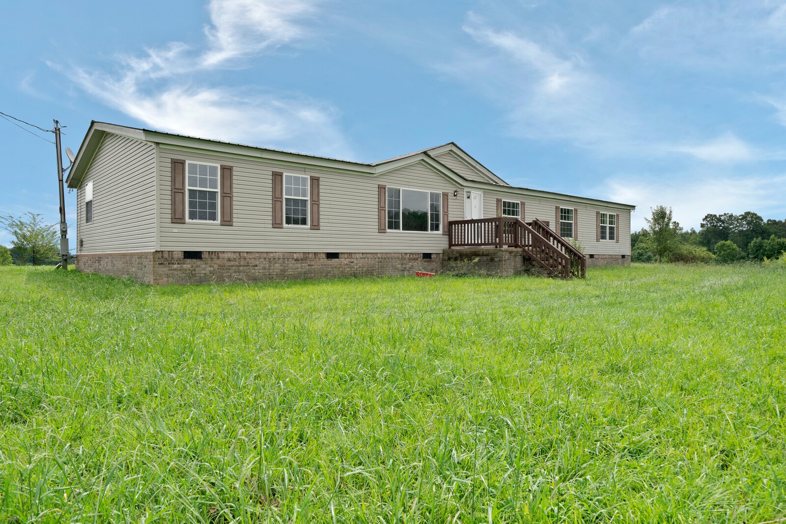 450 Obie Adcock Road Smithville, TN 37166 - Photo 1 of 30 a front view of house with yard and green space