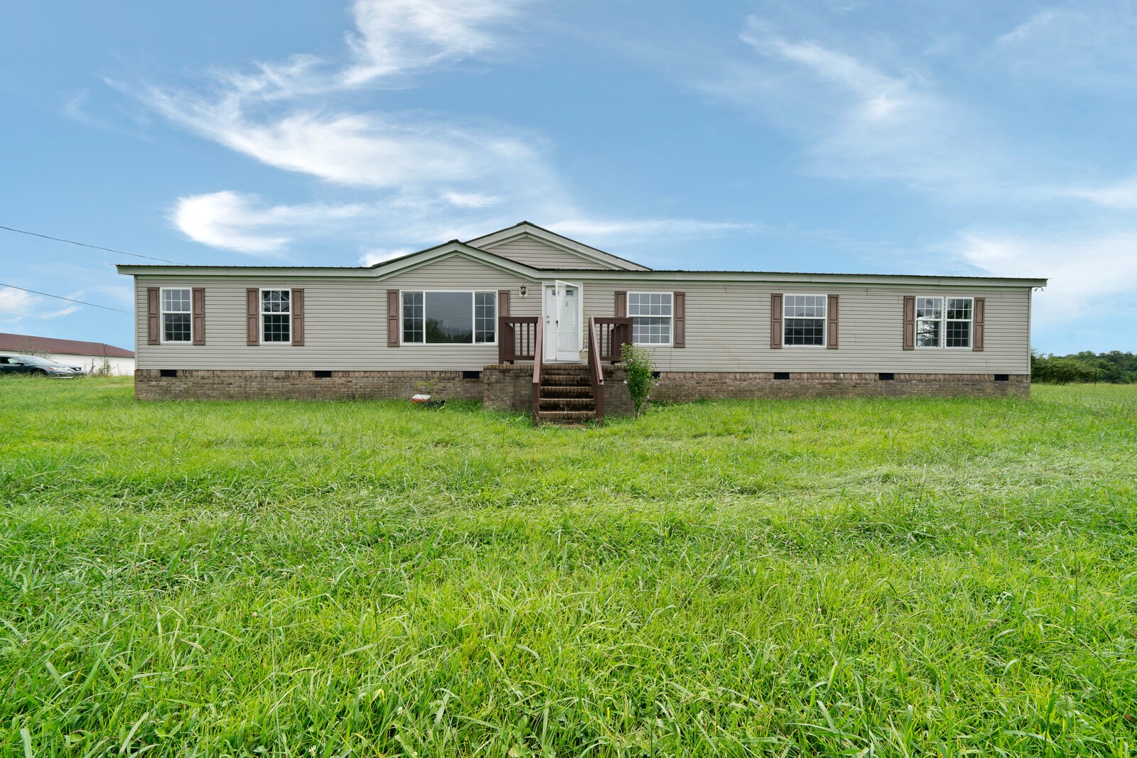450 Obie Adcock Road Smithville, TN 37166 - Photo 25 of 30 a big house with a big yard and large trees