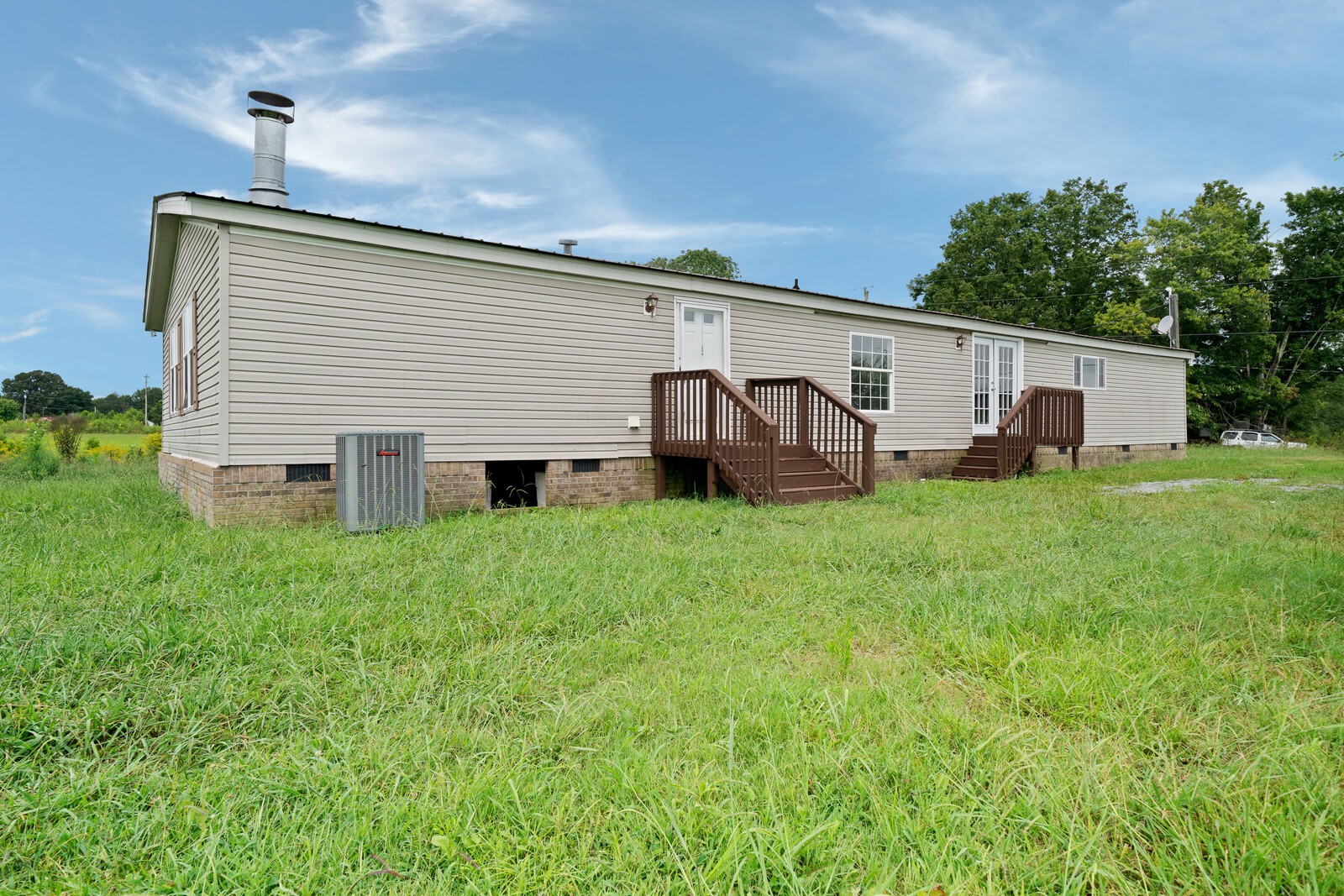 450 Obie Adcock Road Smithville, TN 37166 - Photo 28 of 30 a view of a house with backyard and sitting area