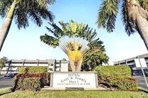 a view of ocean with palm trees