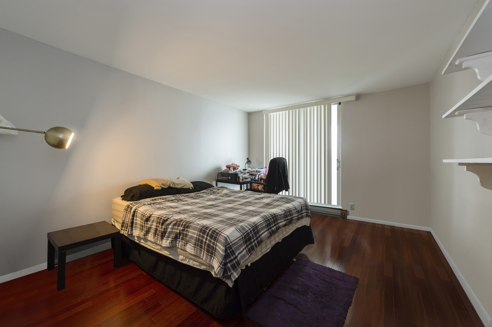 6033 North Sheridan Road, Unit 39G Chicago, IL 60660 - Photo 7 of 15 a bedroom with a bed and wooden floor