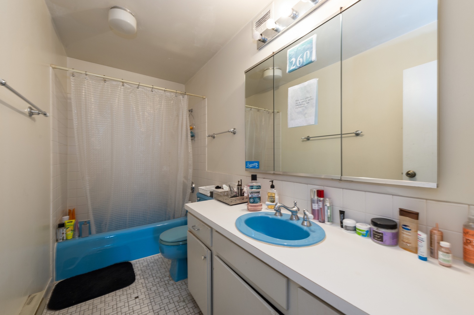 6033 North Sheridan Road, Unit 39G Chicago, IL 60660 - Photo 8 of 15 a bathroom with a sink a toilet and a mirror