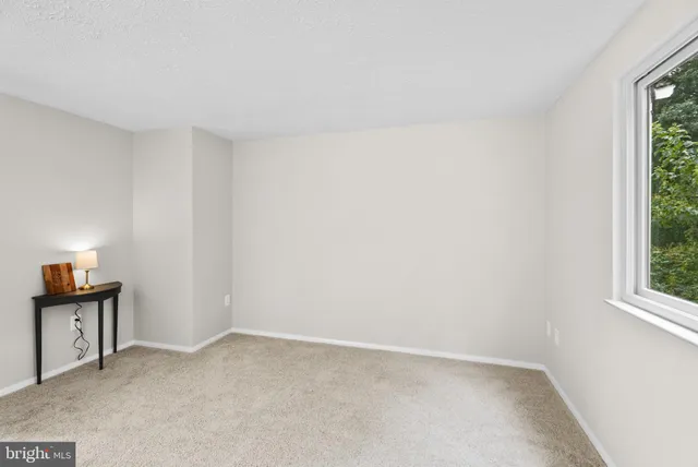 a view of an empty room and window