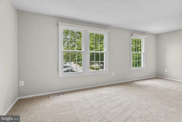 a view of an empty room and closet