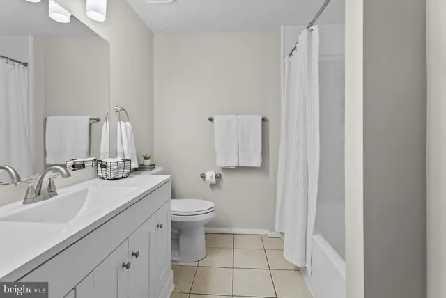 a view of an empty room and a fireplace