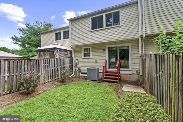 a garden with wooden fence