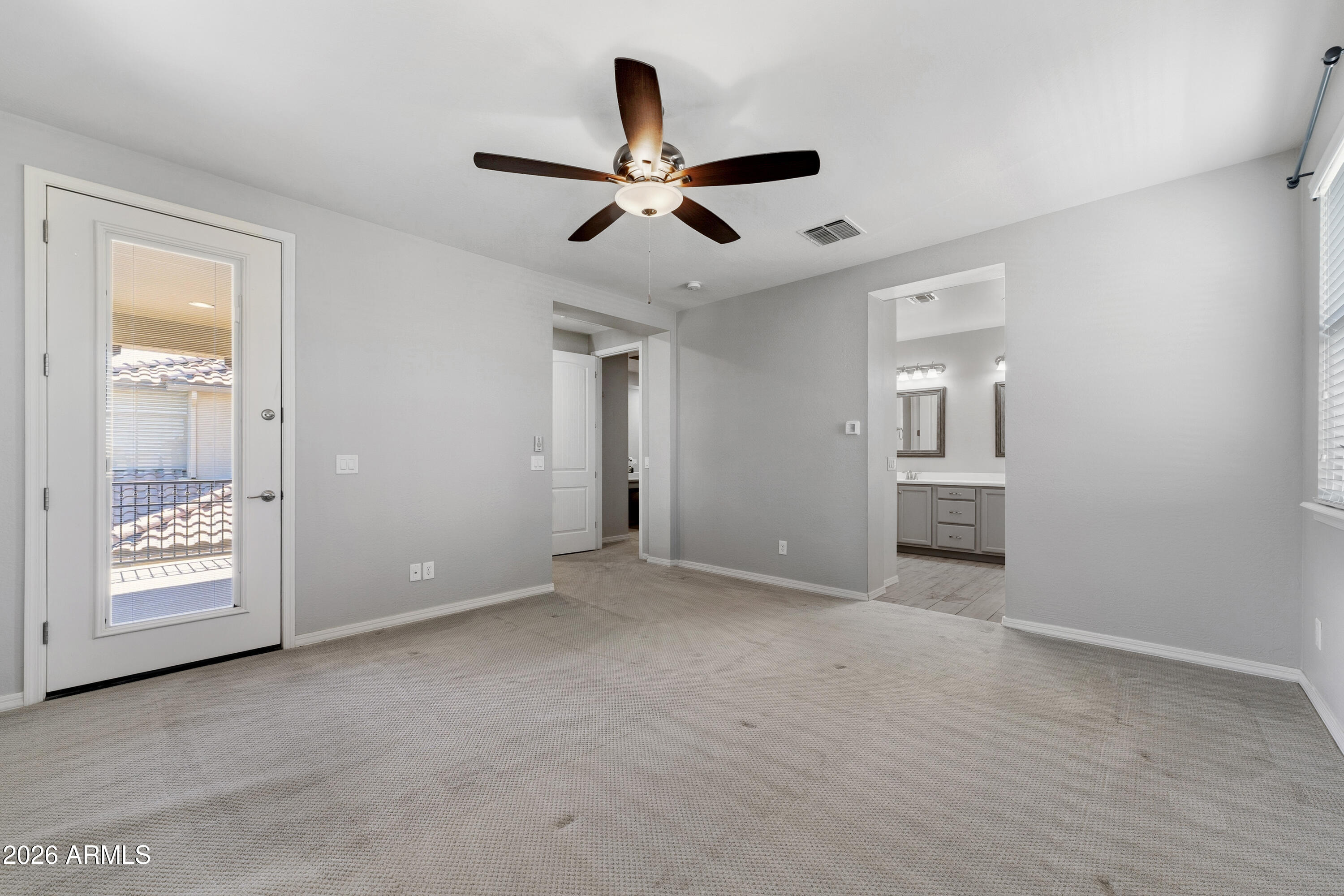 3909 East Perkinsville Street Gilbert, AZ 85295 - Photo 21 of 29 a view of an empty room with a ceiling fan