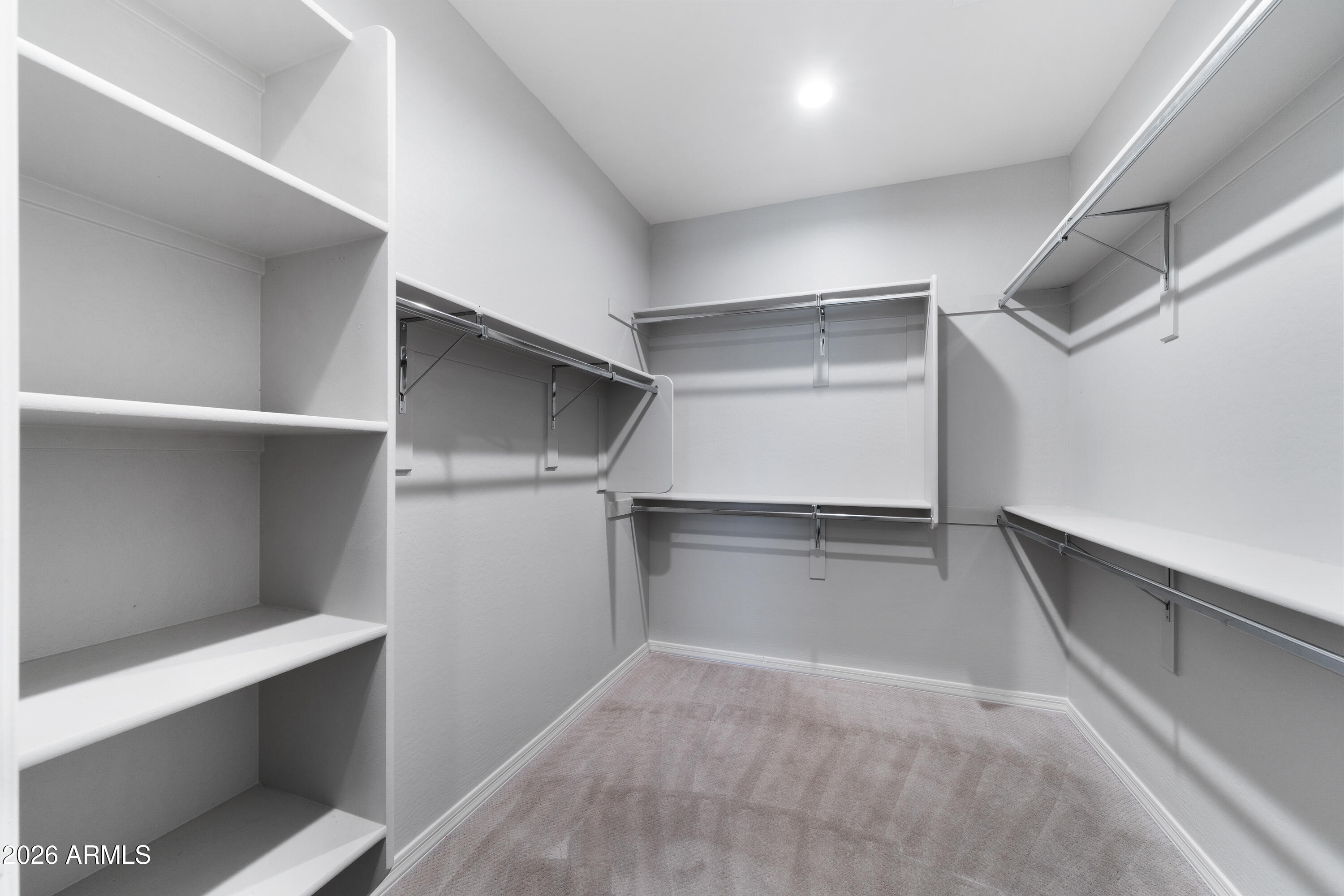 3909 East Perkinsville Street Gilbert, AZ 85295 - Photo 23 of 29 a view of an empty walk in closet