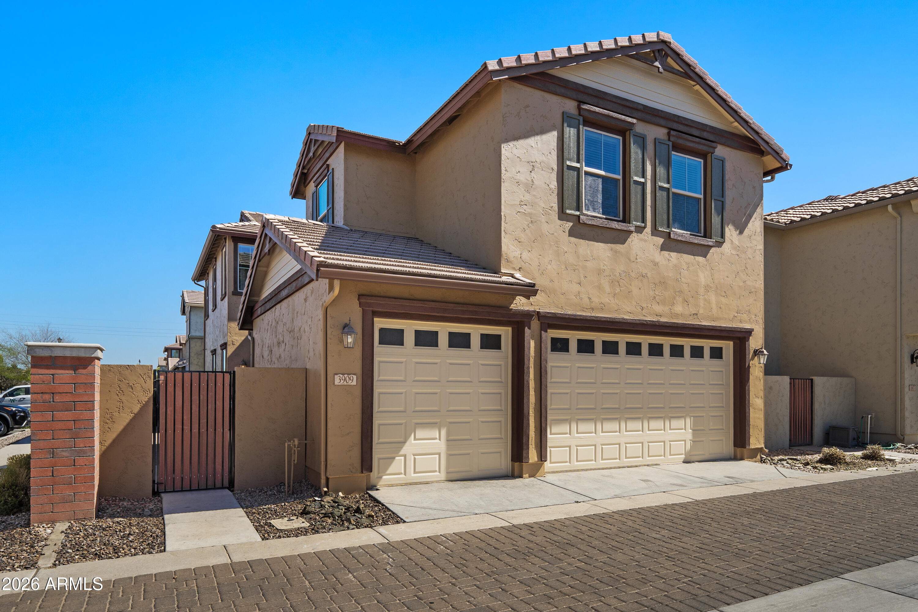 3909 East Perkinsville Street Gilbert, AZ 85295 - Photo 29 of 29 a front view of a house with parking area