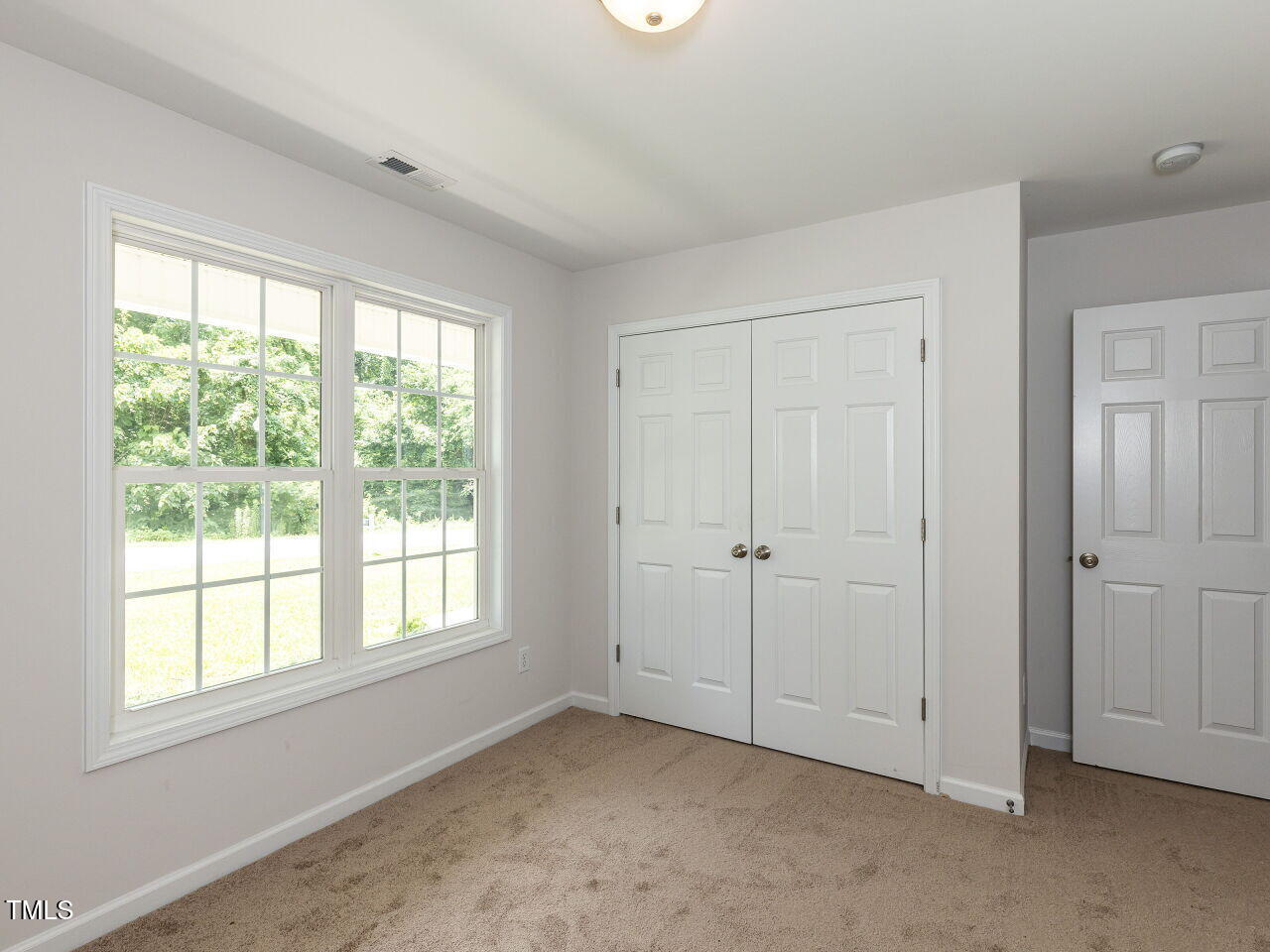 381 Gray Ghost Street Benson, NC 27504 - Photo 17 of 33 a view of an empty room with a window