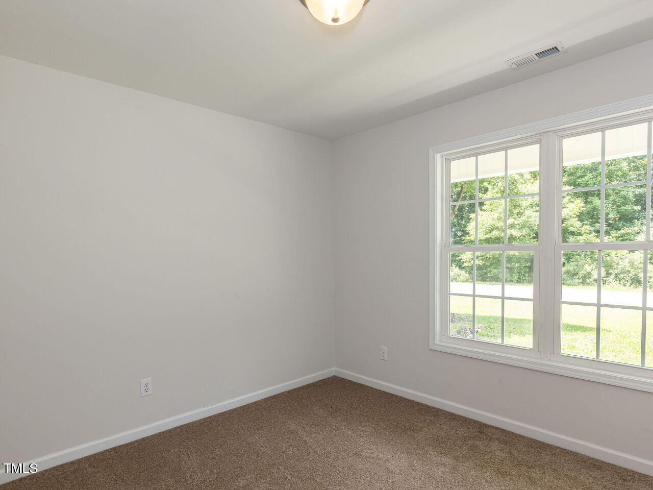 381 Gray Ghost Street Benson, NC 27504 - Photo 18 of 33 an empty room with a window