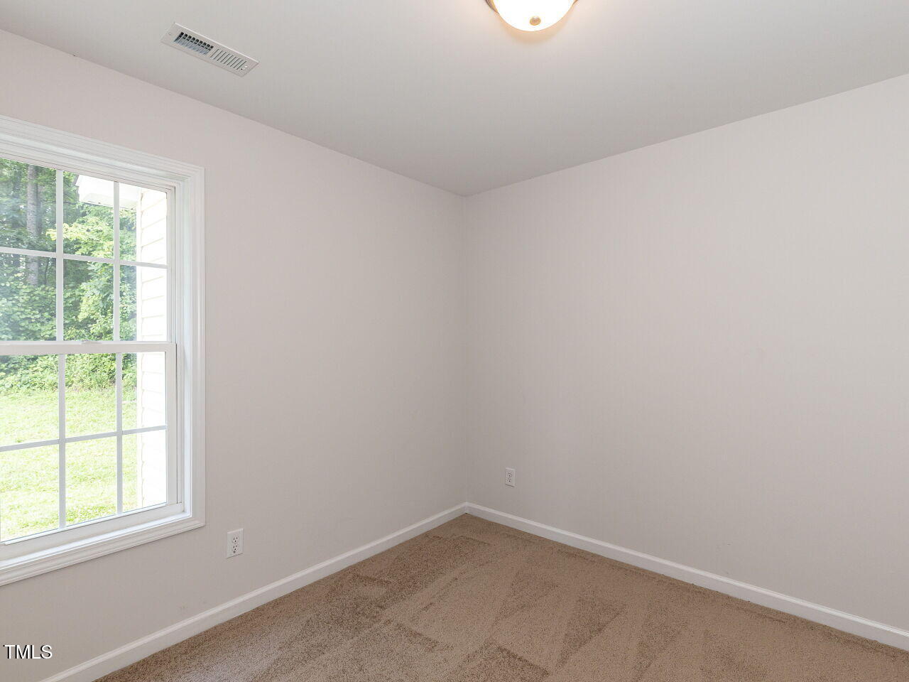 381 Gray Ghost Street Benson, NC 27504 - Photo 20 of 33 an empty room with a window