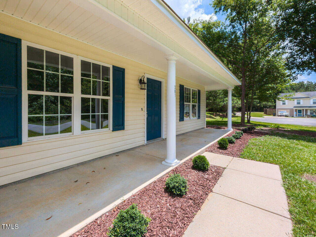 381 Gray Ghost Street Benson, NC 27504 - Photo 2 of 33 a house with garden in front of it