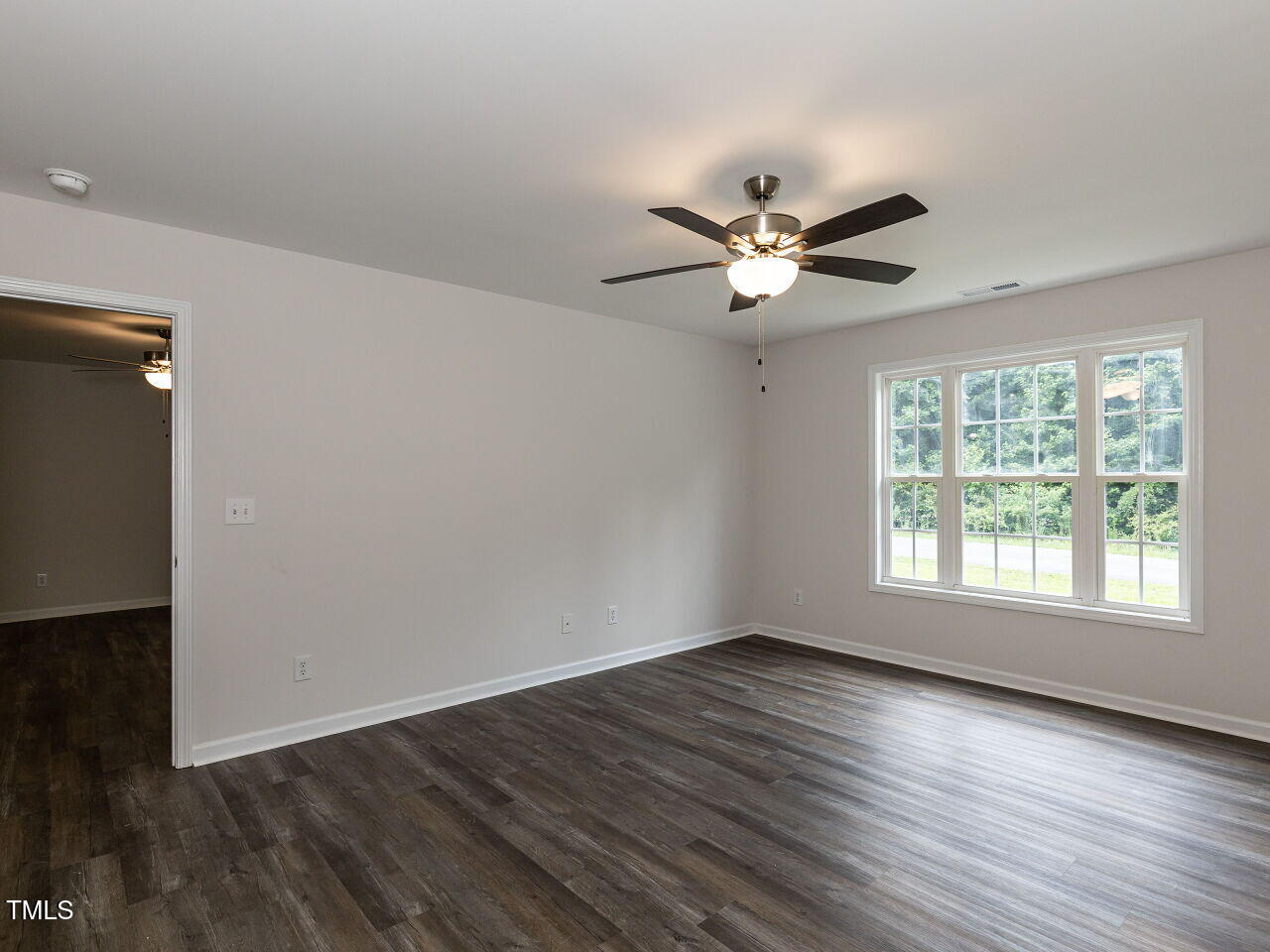 381 Gray Ghost Street Benson, NC 27504 - Photo 25 of 33 an empty room with wooden floor and windows