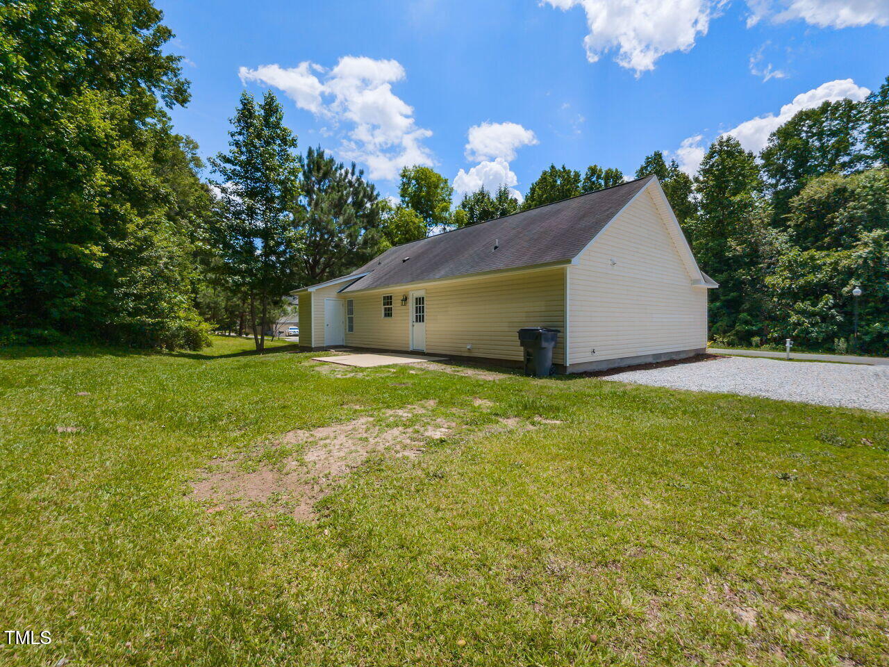 381 Gray Ghost Street Benson, NC 27504 - Photo 32 of 33 a view of a big house with a big yard and potted plants