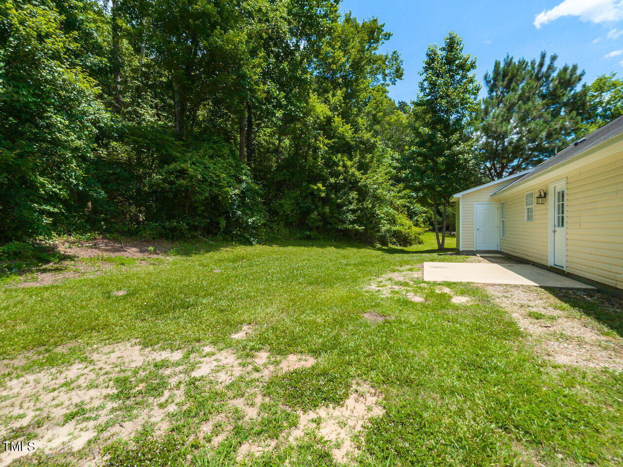 381 Gray Ghost Street Benson, NC 27504 - Photo 33 of 33 a backyard of a house with lots of green space