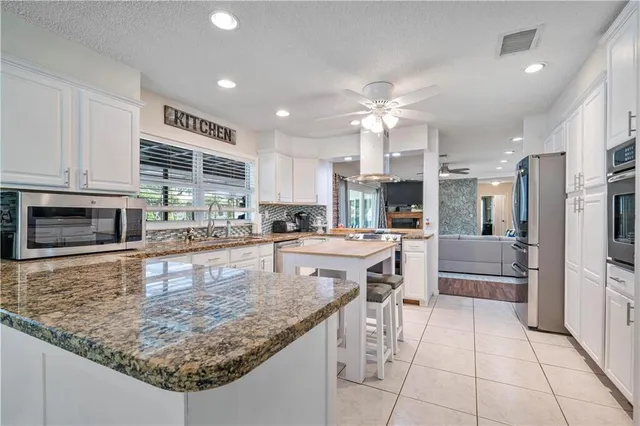 a large kitchen with cabinets