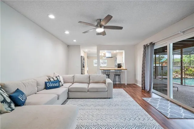 a living room with furniture fireplace and flat screen tv