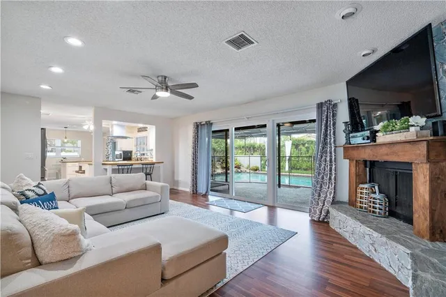 a bedroom with a bed couch and window