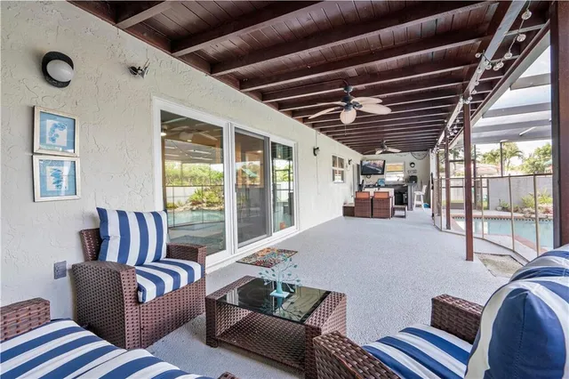 a kitchen with stainless steel appliances granite countertop a sink and wooden cabinets