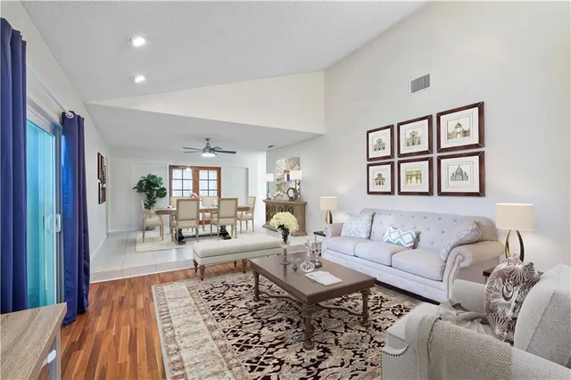 a living room with furniture or couch and a wooden floor