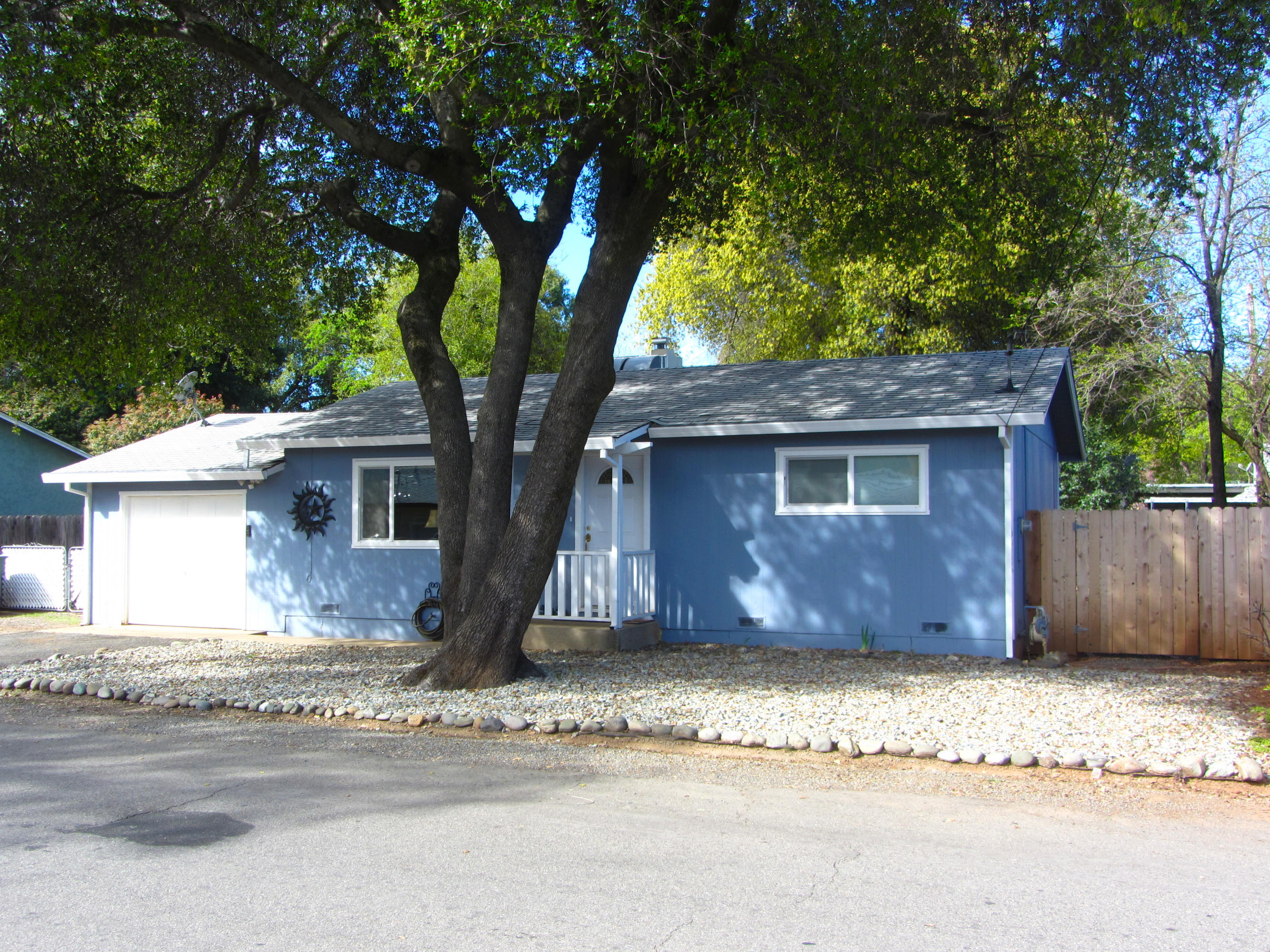 2862 Irwin Road Redding, CA 96002 - Photo 1 of 19 a front view of a house with a garden