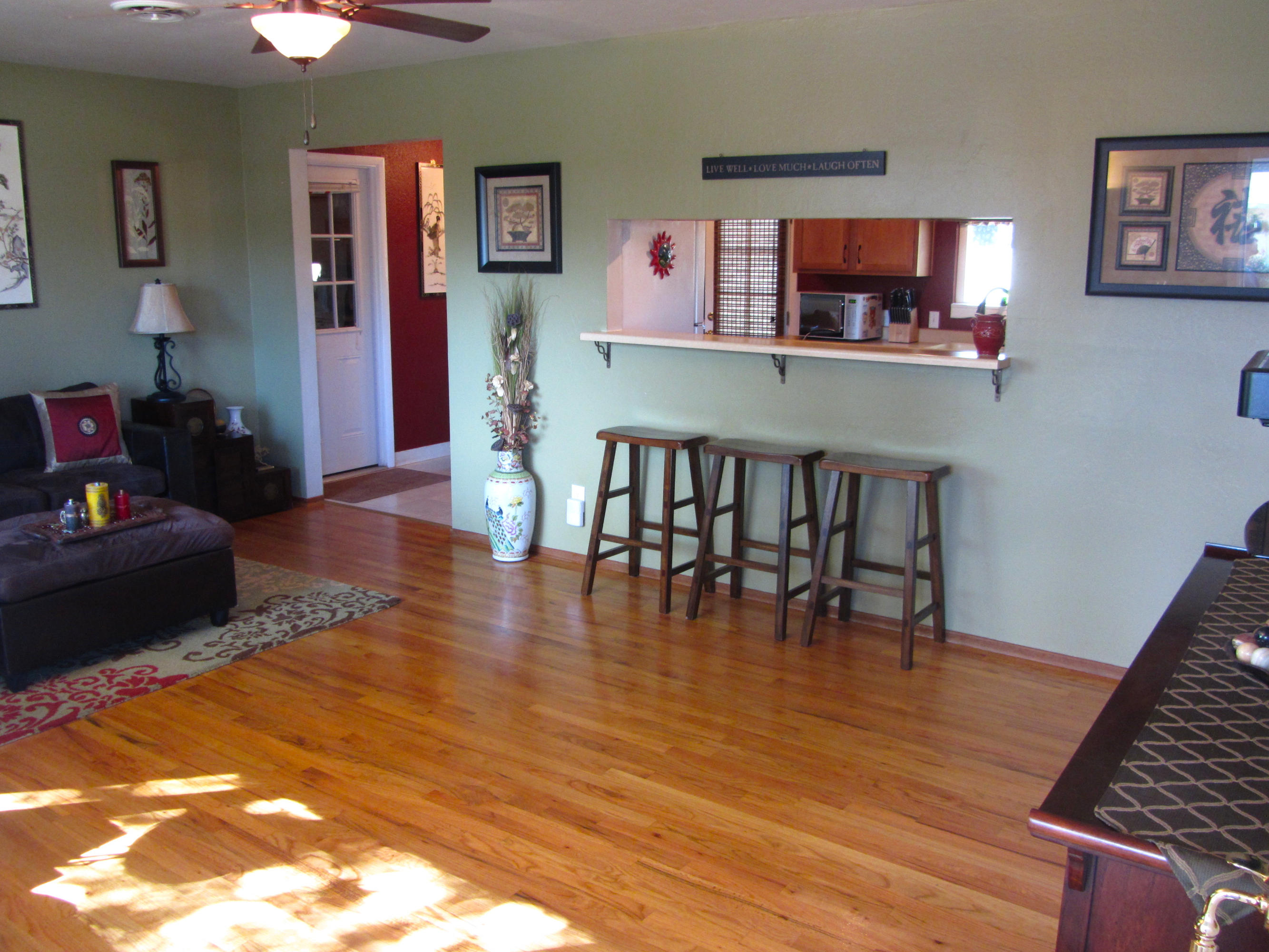2862 Irwin Road Redding, CA 96002 - Photo 5 of 19 a dining room with furniture and wooden floor