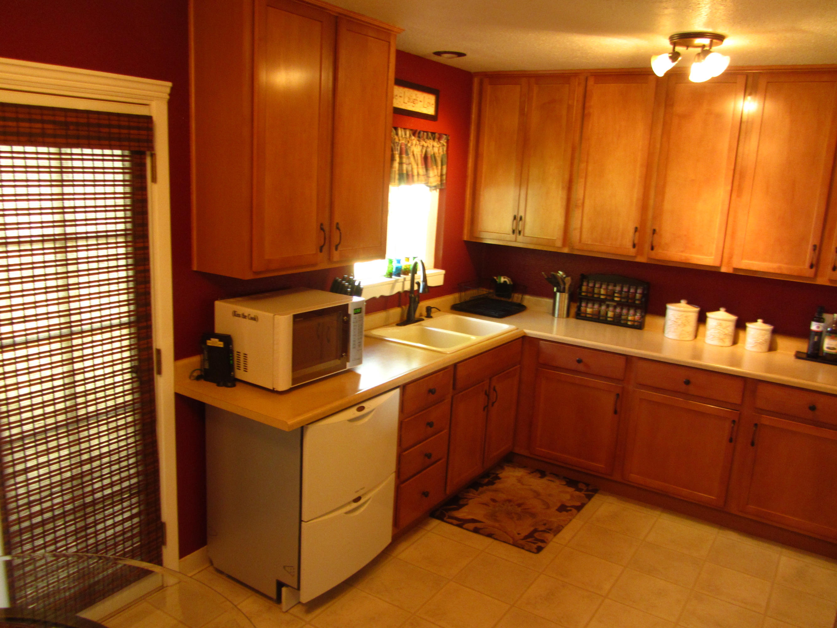 2862 Irwin Road Redding, CA 96002 - Photo 10 of 19 a kitchen with a sink and cabinets