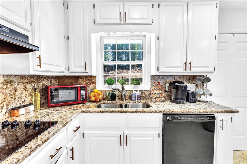 3571 Turner Heights Drive Decatur, GA 30032 - Photo 16 of 51 a kitchen with stainless steel appliances granite countertop a sink stove and cabinets