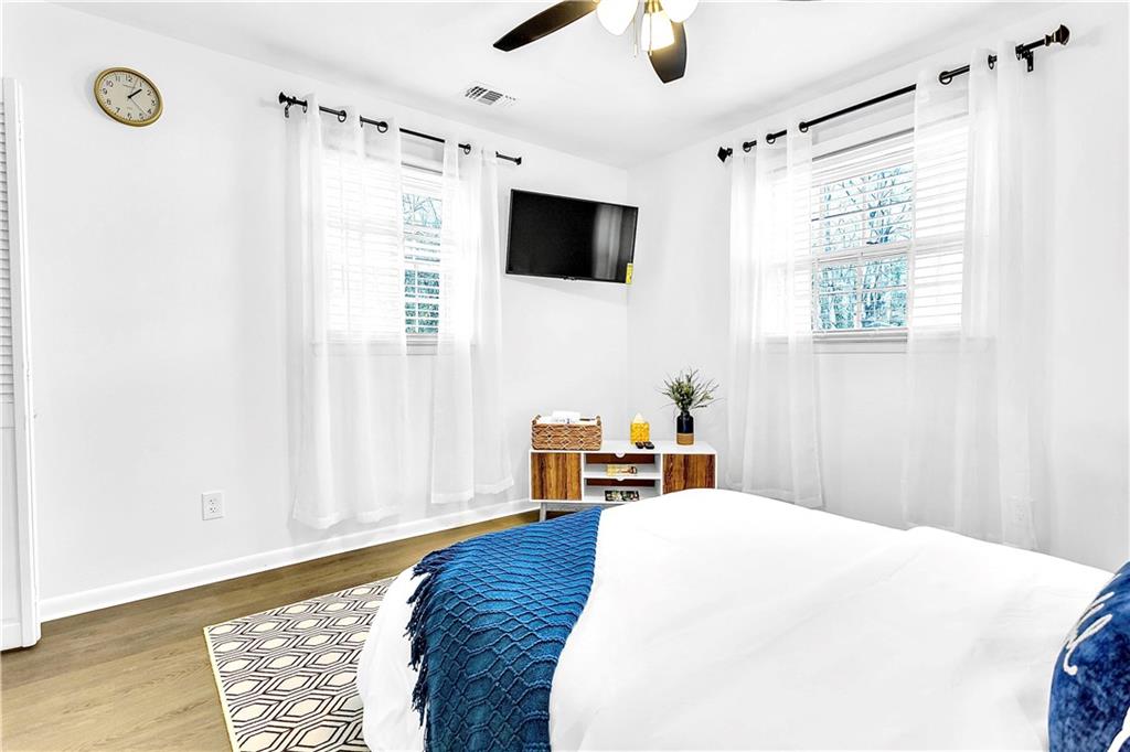 3571 Turner Heights Drive Decatur, GA 30032 - Photo 18 of 51 a bedroom with a bed and a flat screen tv