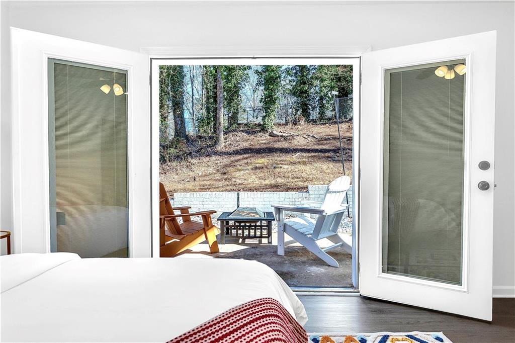 3571 Turner Heights Drive Decatur, GA 30032 - Photo 23 of 51 a bedroom with a bed and wooden floor