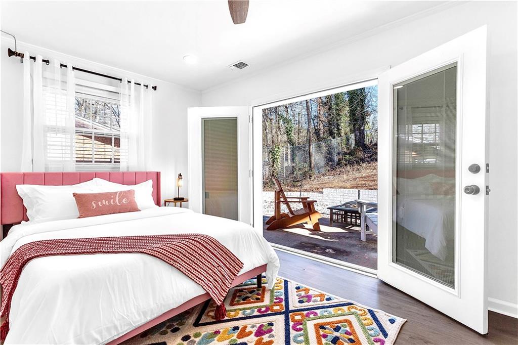 3571 Turner Heights Drive Decatur, GA 30032 - Photo 24 of 51 a bedroom with a bed and wooden floor