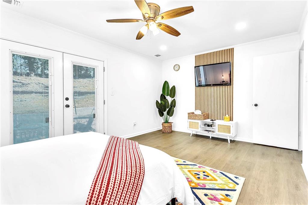 3571 Turner Heights Drive Decatur, GA 30032 - Photo 25 of 51 a bedroom with a bed and a chandelier