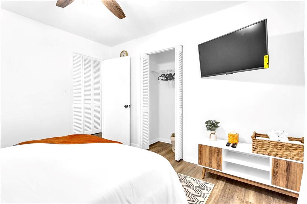 3571 Turner Heights Drive Decatur, GA 30032 - Photo 31 of 51 a bedroom with a bed and a flat screen tv